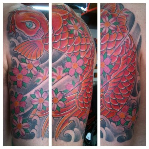 Awesome Colored Carp Fish Tattoo On Man Left Sleeve